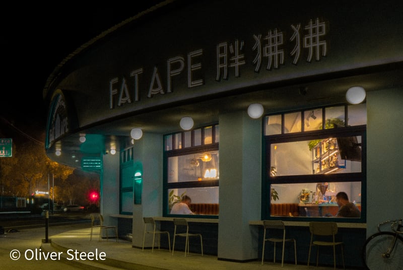 When I passed this shop at night, it reminded me of the Hopper painting. From memory, I tried to find a similar angle. Then I graded the color (warmed the interior, cooled the exterior, dodged the trees and made them more orange) to match.