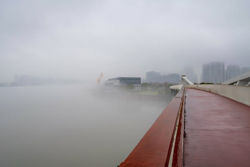 Northwards view along the Chuanshang Bridge over the Chuanyang River, as it joins the Huangpu River on the left.