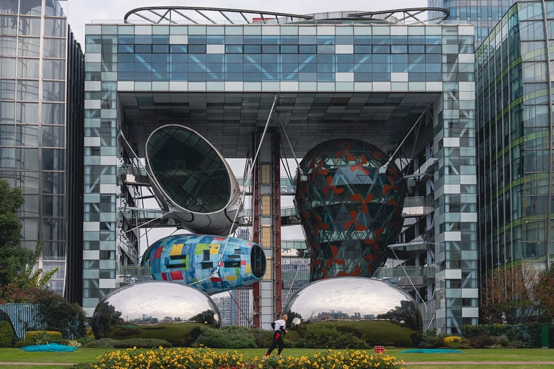 This structure at Gao Yang, designed by Will Alsop for the Shanghai Port International Cruise Terminal, features a hanging four-story restaurant and two bars suspended in brightly-colored pods. As seen from the waterfront.