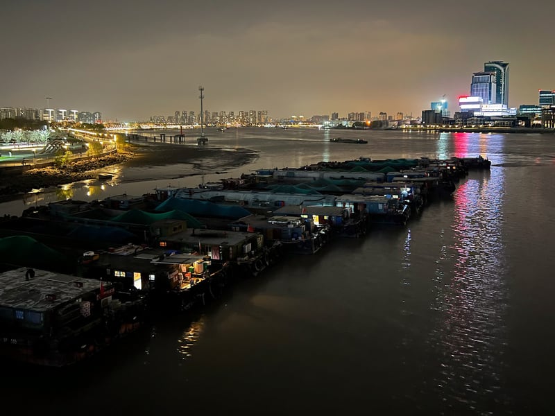 The mouth of the Chuanyang River (canal), where it open onto the Huangpu. The barges dock here for the night. Minutes earlier, the night’s final barge joined the flotilla.
